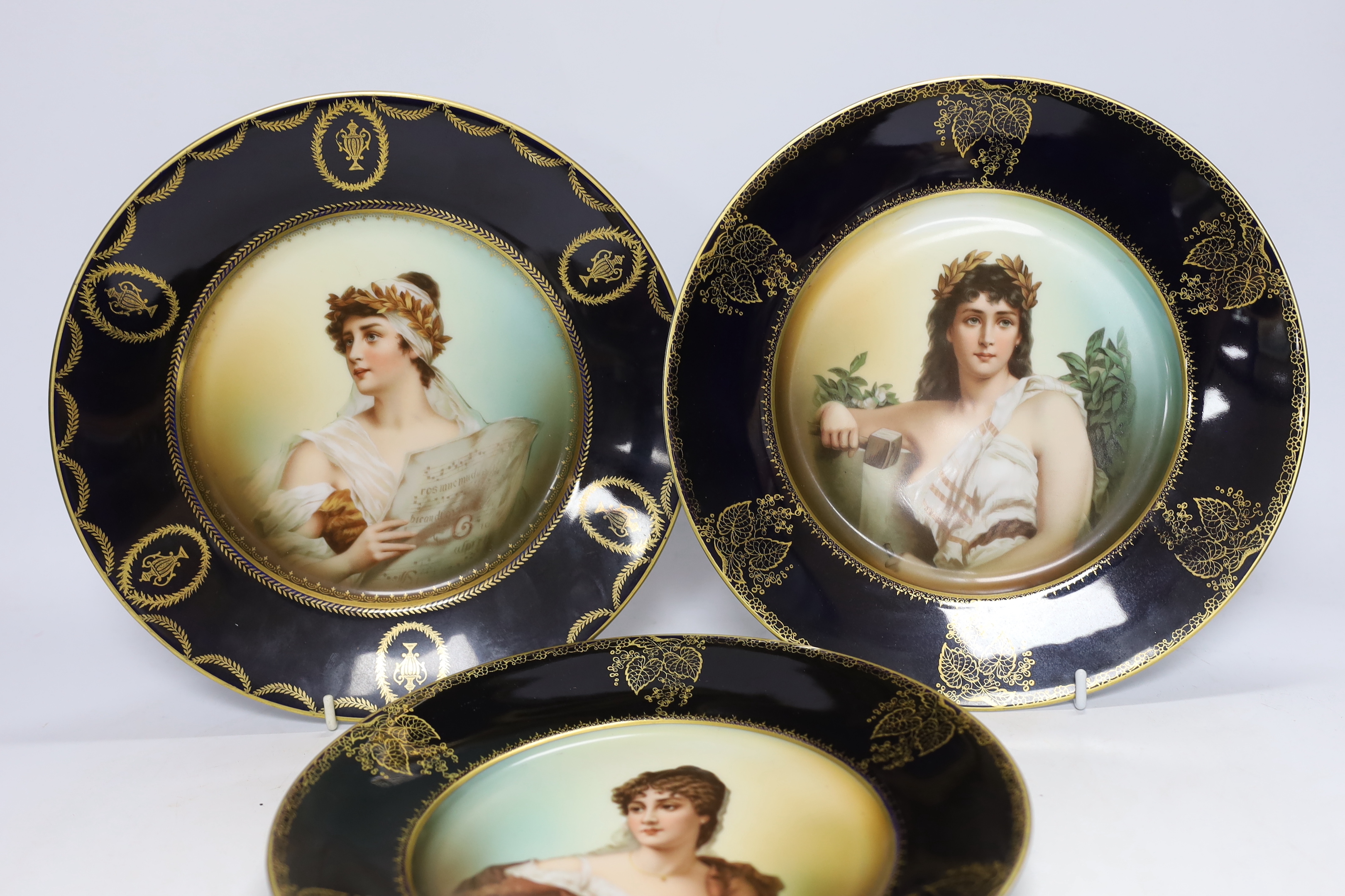 A set of three Rosenthal porcelain cabinet plates, decorated with classical females emblematic of the arts and music, 25.5cm